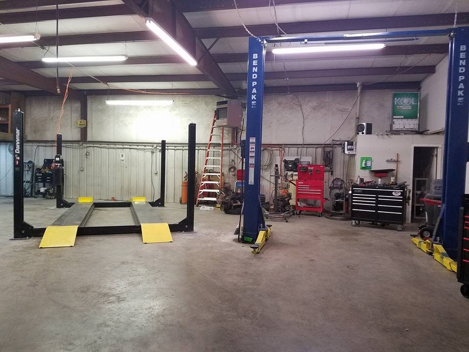 Service bay at Armstrong Automotive Repair with vehicle lifts