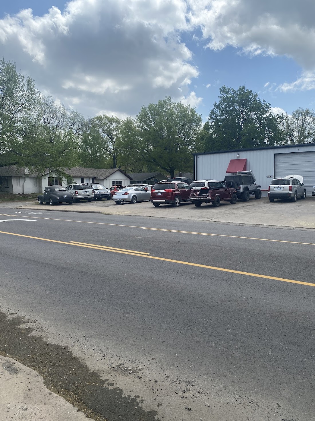 Wide view of the Armstrong Automotive Repair building and lot